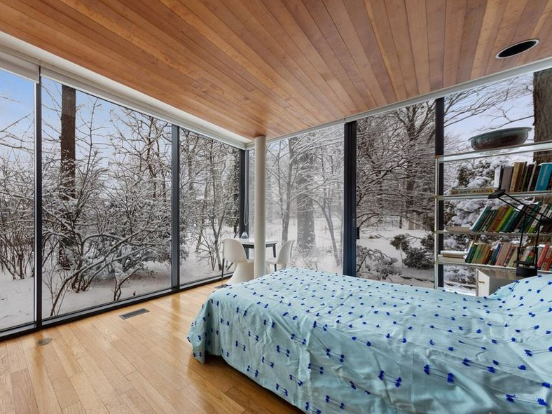 Glass house Illinois bedroom windows wooden floorboards ceiling