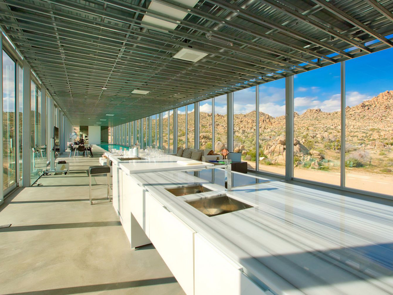 Joshua Tree Invisible House white kitchen glass walls