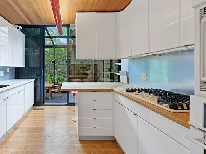 White and wood kitchen glass house Illinois