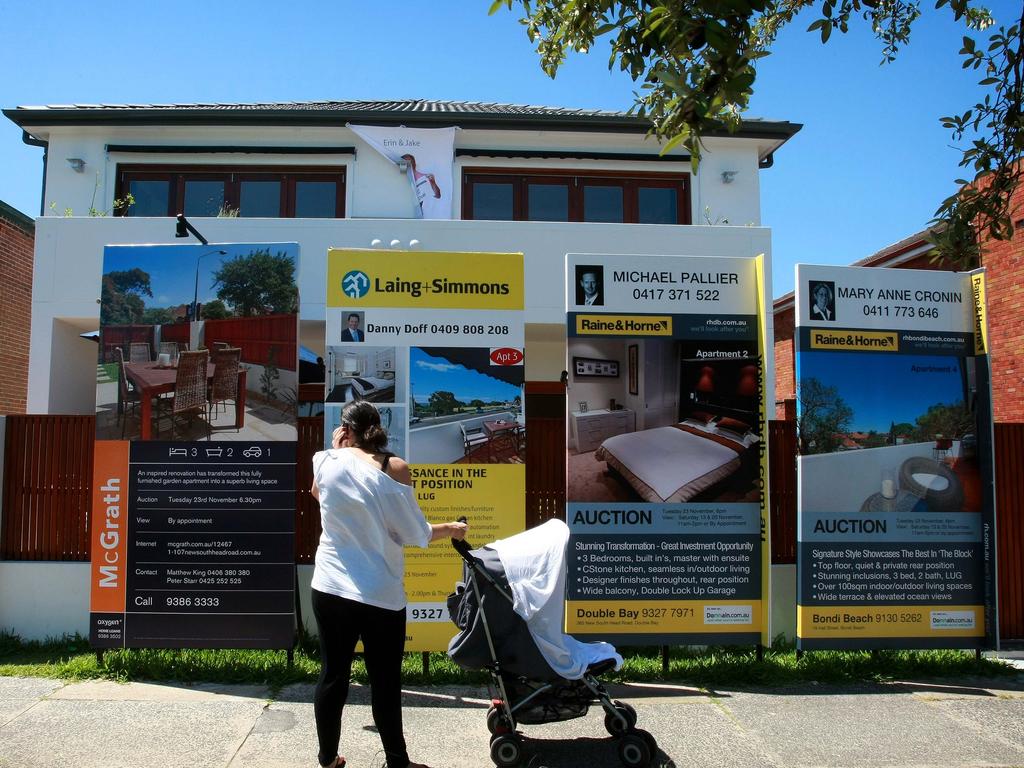 Pictured the Block 107 New South Head Road in Vaucluse, a lady stops to have a closer look.