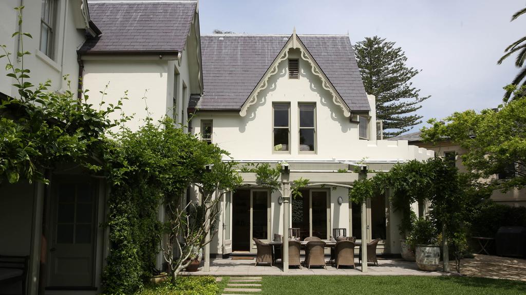 Photograph couple outside $27m house