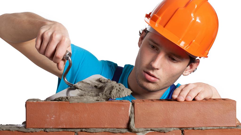 Concentrated bricklayer putting