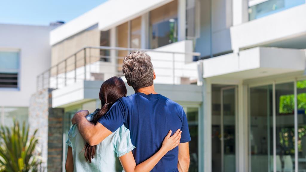 CM New estates magazine - generic young couple looking at new house