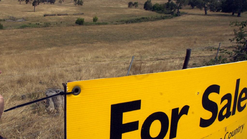 Claudio Curtis and real estate for sale sign on his property at Pages Flat Road, Myponga 18 Jan 2002.  for/sale land