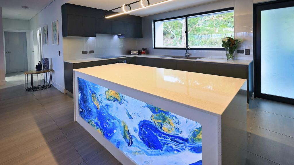 Valle Vista is a brand new complex with eight apartments at 76-78 Intake Road, Redlynch. The waterfall island bench in the kitchen with the illuminated glass panel.