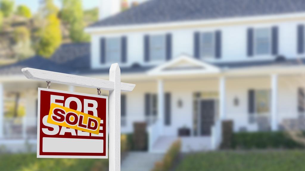 Sold Home For Sale Sign in Front of New House